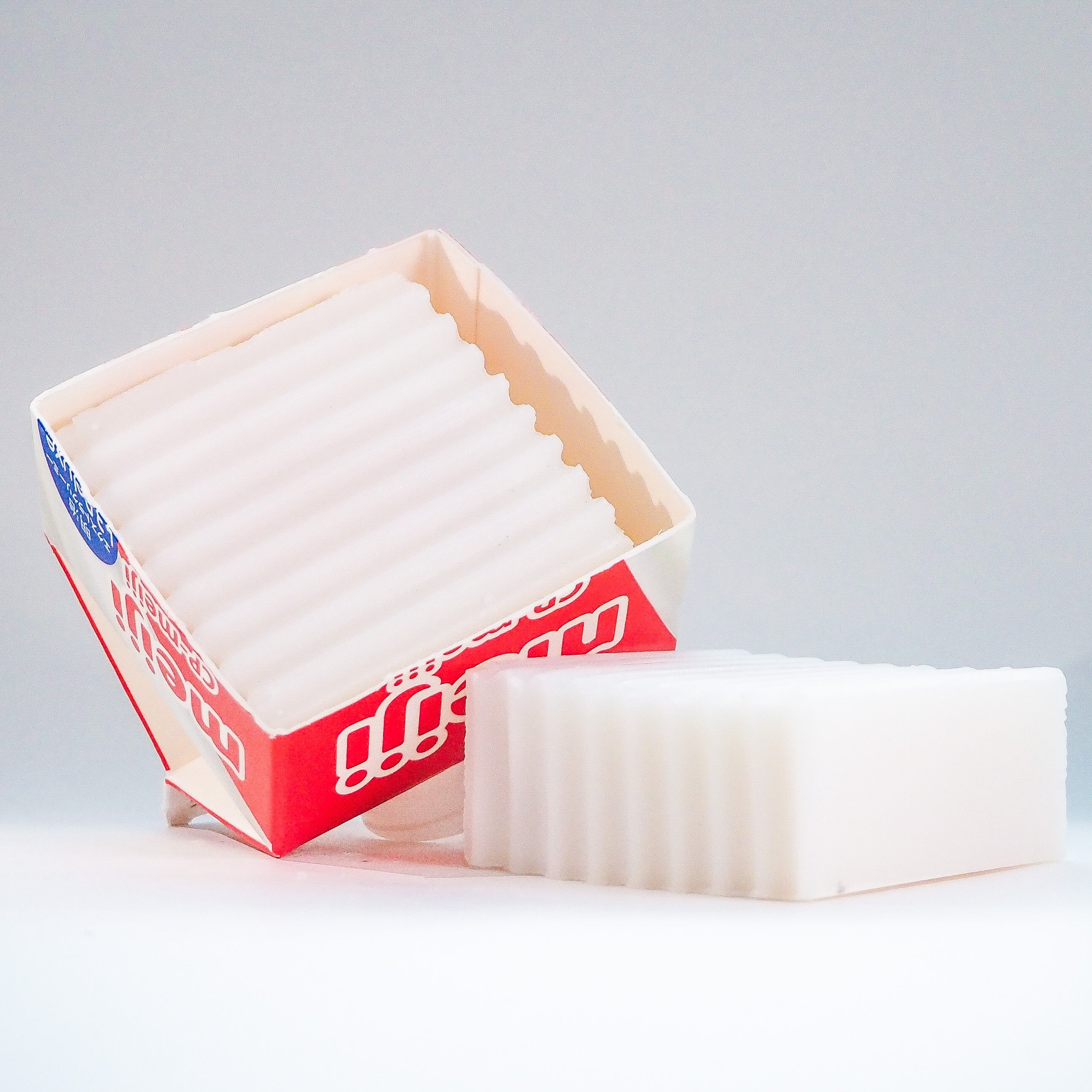 Kitchen Dish Soap in upcycled milk carton dish with another bare on a white and grey background