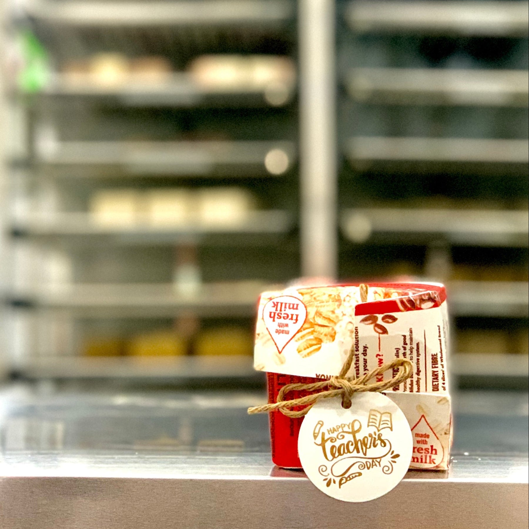 Milk Carton with Teachers' day gift tag on soap crafting table