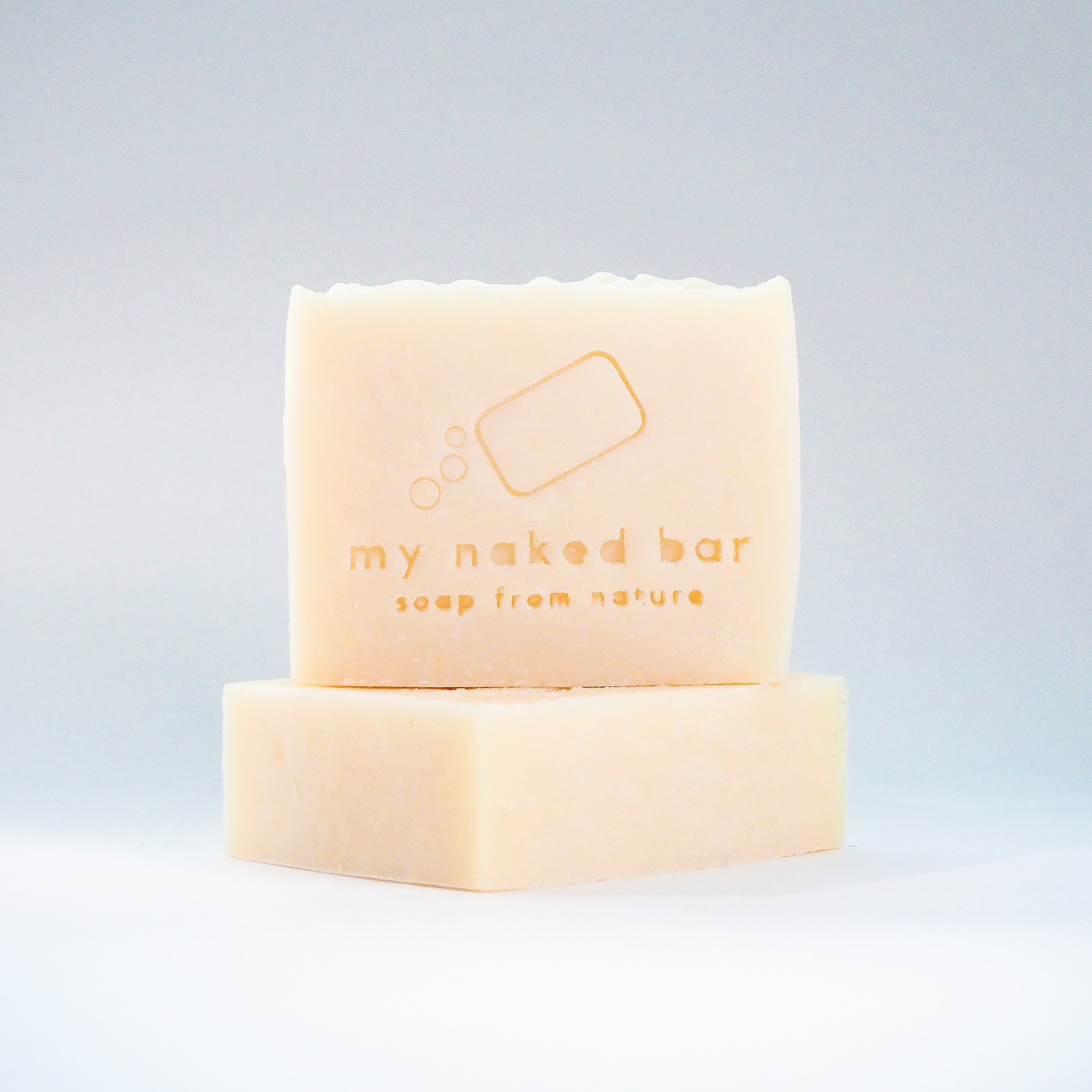 Front view of Rice Milk Soap Bar stacked on another bar lying down